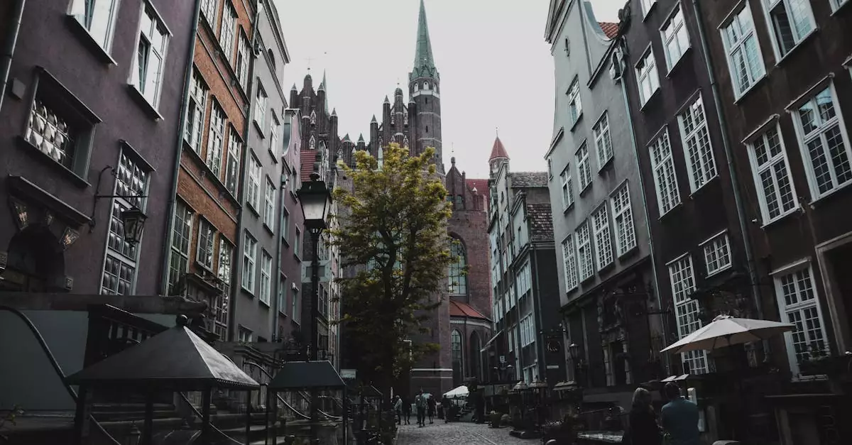 Cobblestone street in Gdańsk, Poland, featuring Gothic architecture and a vibrant urban atmosphere.