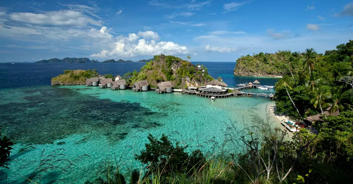 A breathtaking view of Misool Resort's crystal-clear waters and lush islands in West Papua, Indonesia.