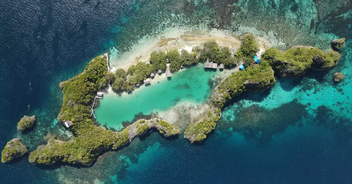 Stunning aerial shot of a beautiful tropical island in Indonesia, surrounded by clear waters.