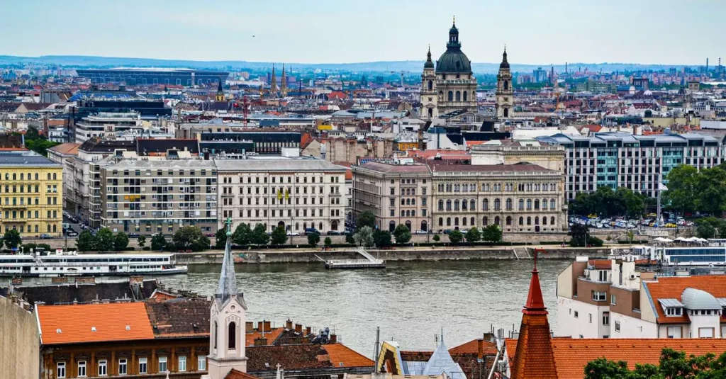 Stunning view of Budapest cityscape featuring historic architecture along the Danube River.