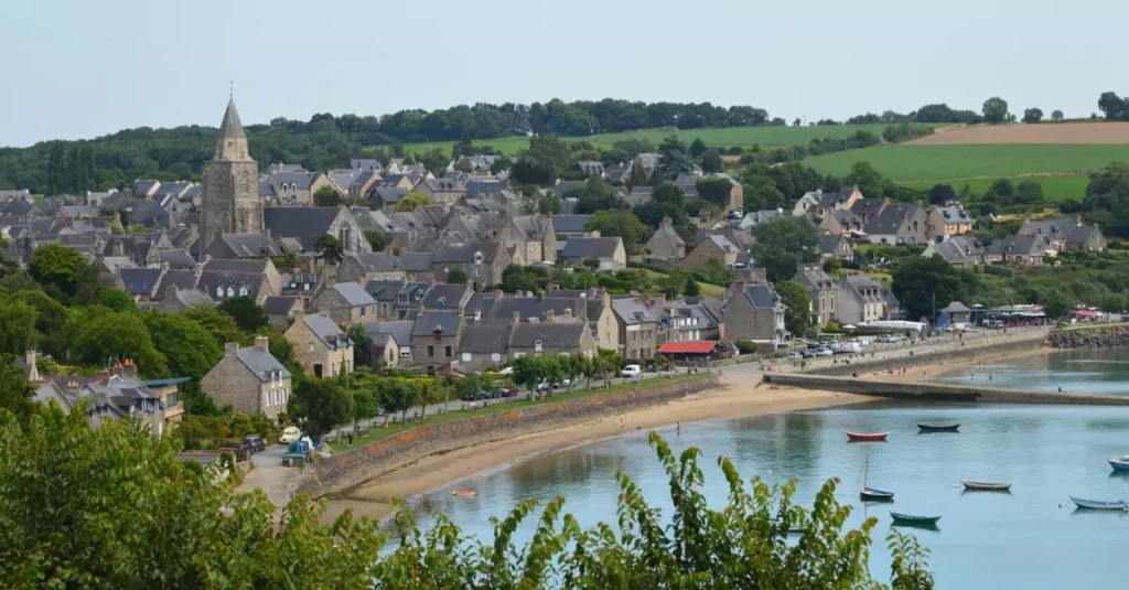 A picturesque view of the charming village of Saint-Suliac in Bretagne, France, overlooking the coast.