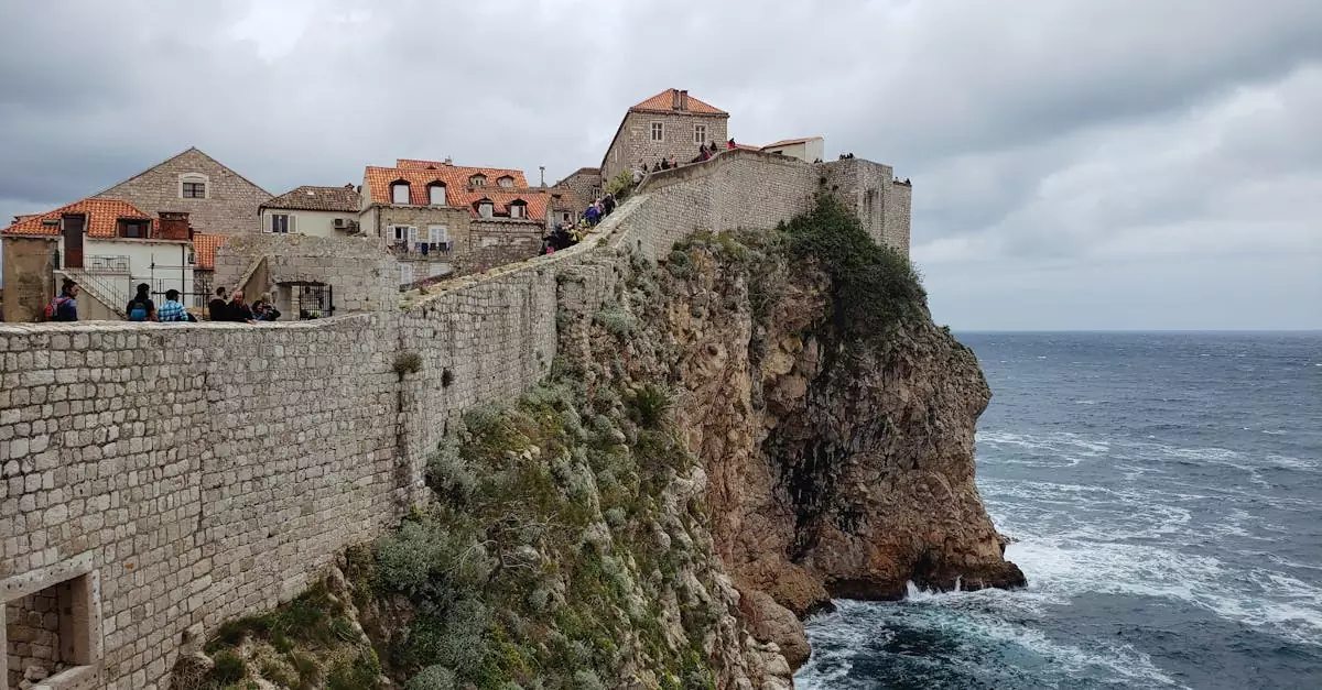 Breathtaking view of Dubrovnik's historic city walls perched above the Adriatic Sea.