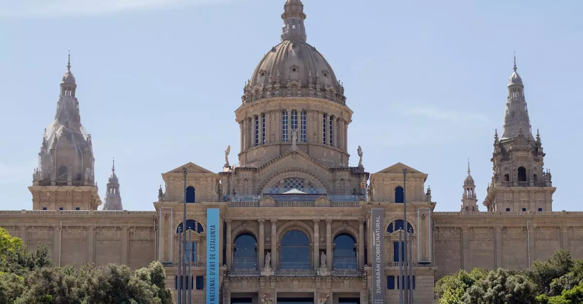 Front view of the National Art Museum of Catalonia showcasing its grand architecture under a clear sky.