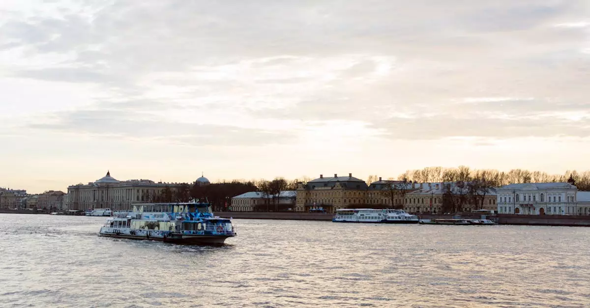 A river scene in Saint Petersburg, Russia with a boat cruising by historic architecture during a serene day.