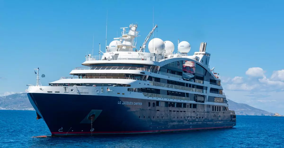 A luxury cruise ship sailing on open blue waters under a clear sky.
