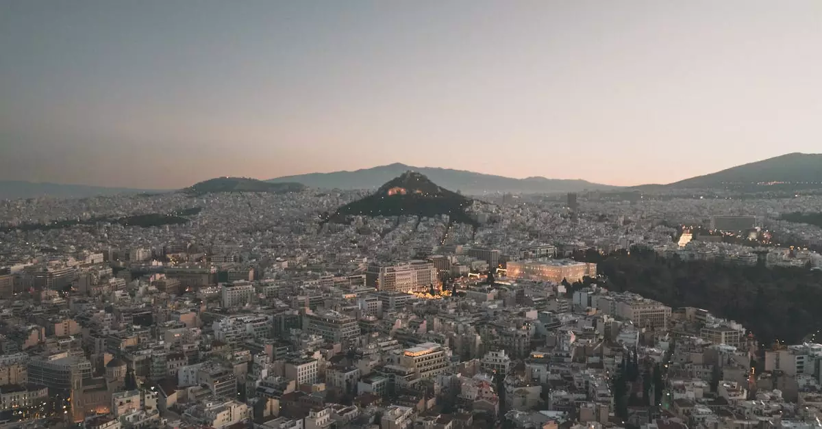 Stunning aerial view of Athens' cityscape with horizon at twilight.