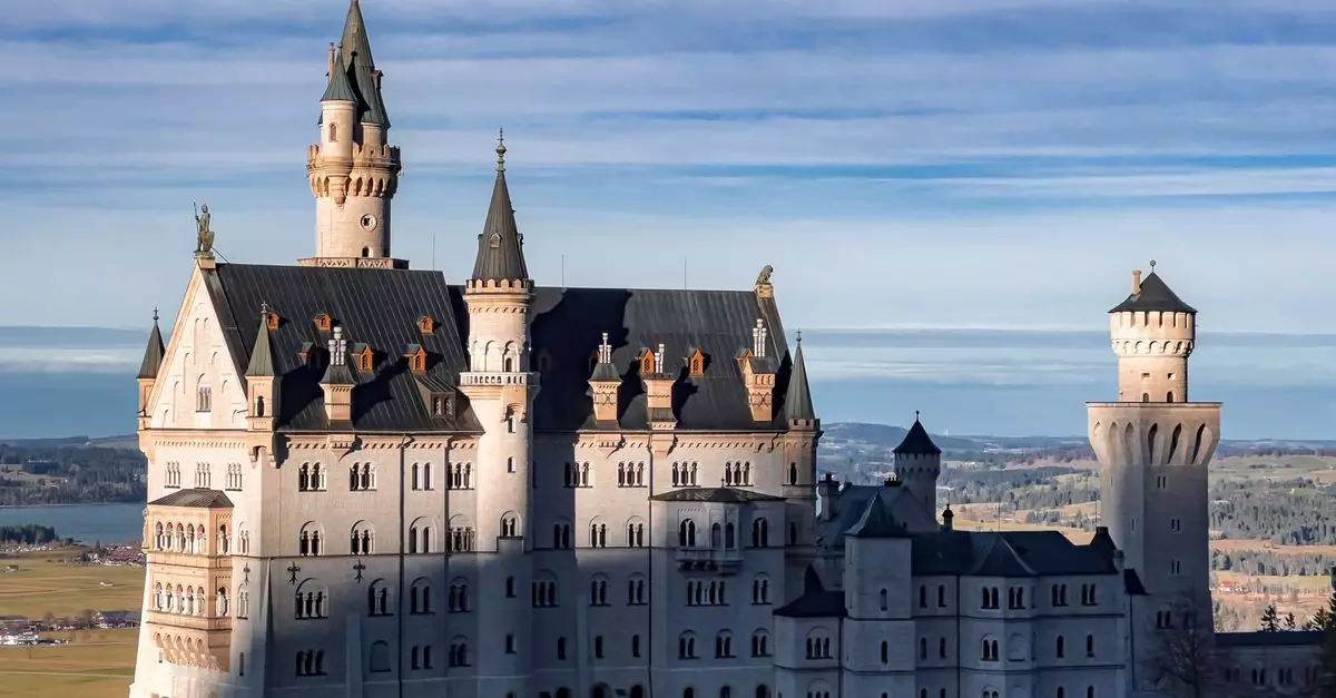 Majestic Neuschwanstein Castle set against a clear blue sky in Bavaria, Germany.