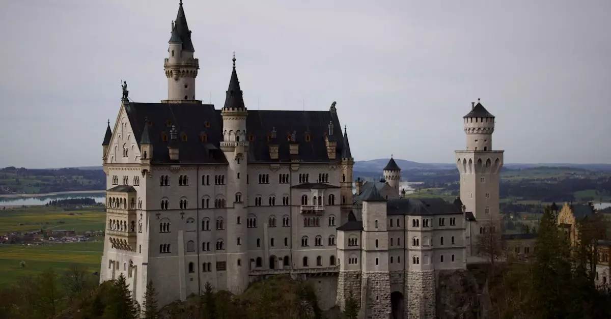 Stunning view of Neuschwanstein Castle surrounded by lush Bavarian landscape.
