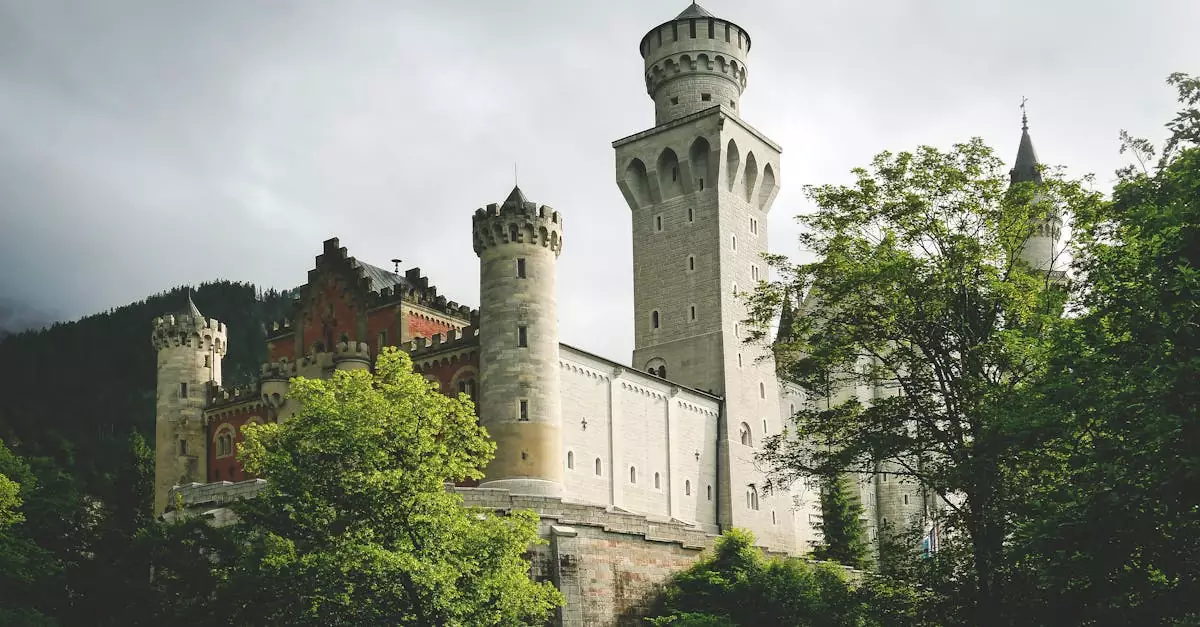 Stunning image of Neuschwanstein Castle surrounded by lush greenery in Bavaria, Germany.