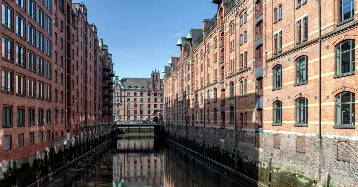 View of Hamburg's iconic Speicherstadt district with canal reflection.