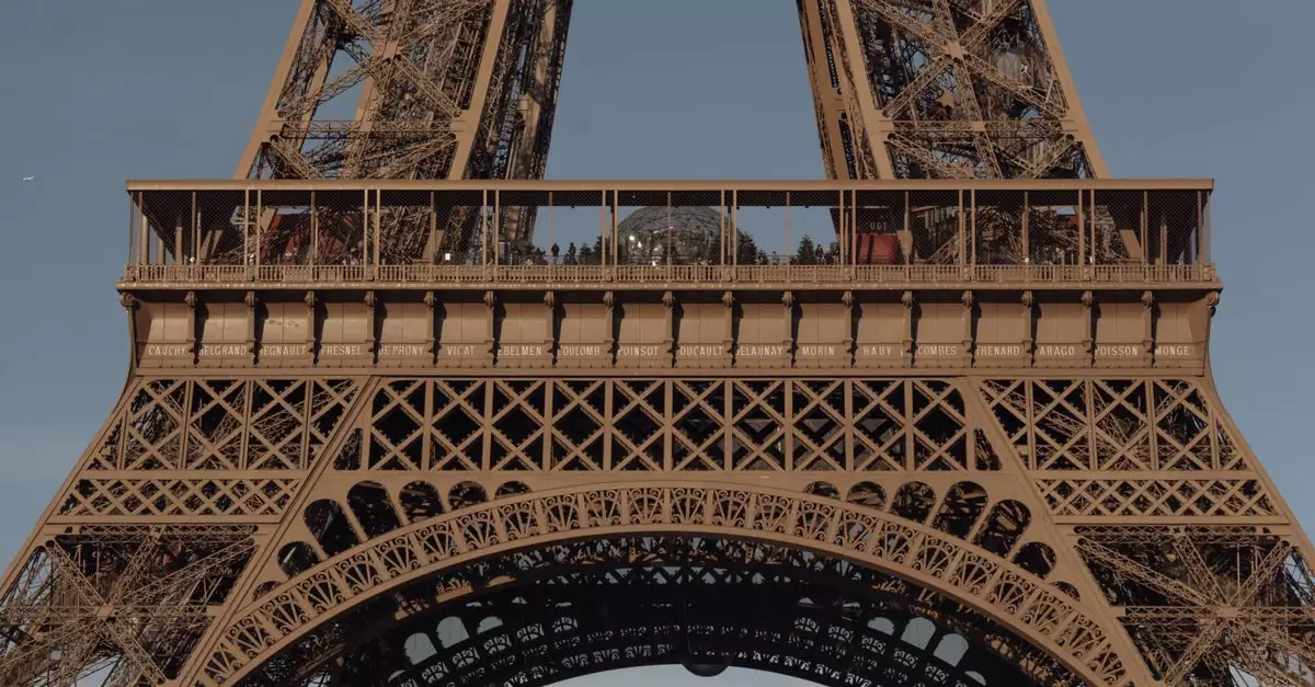 A detailed close-up of the Eiffel Tower's intricate iron lattice in Paris, France.