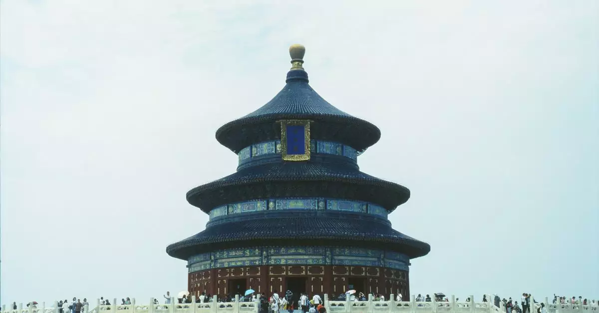 The iconic Temple of Heaven in Beijing, a renowned UNESCO World Heritage site, with visiting tourists.