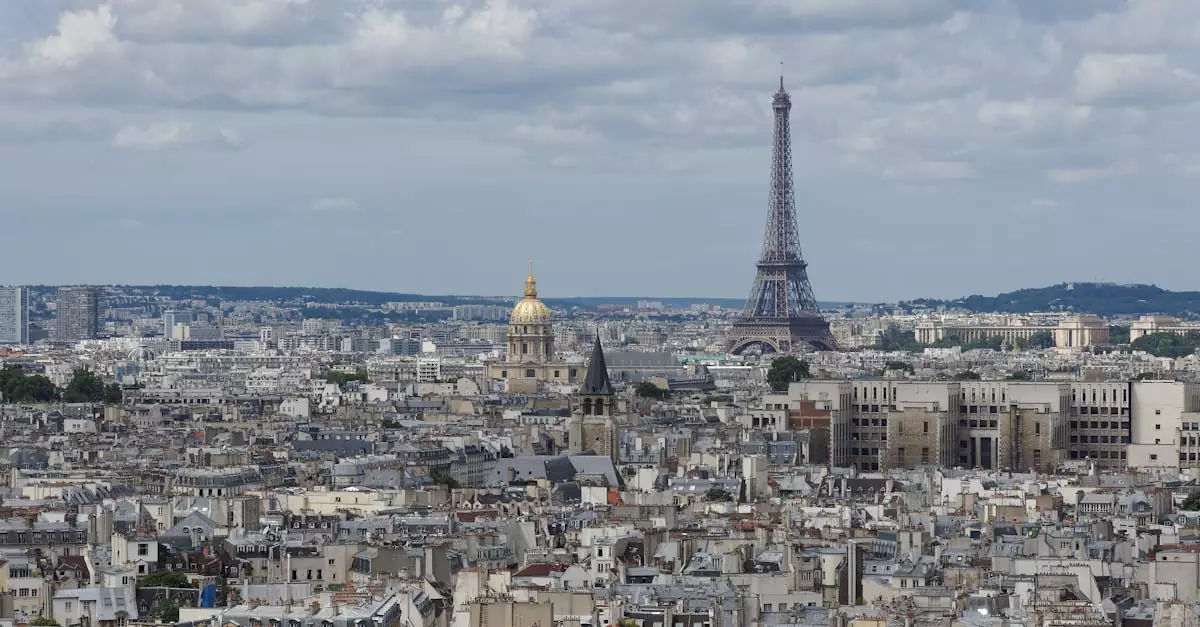 Aerial view of Paris featuring the iconic Eiffel Tower and the city's urban landscape.