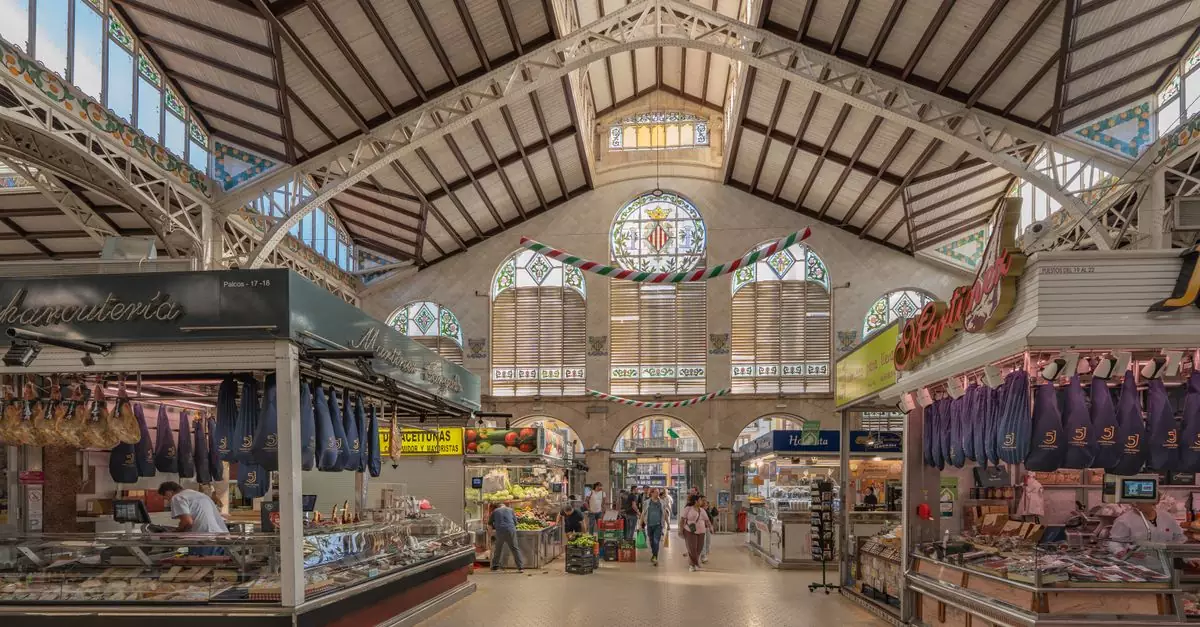Captivating interior of Valencia's Central Market showcasing vibrant food stalls.