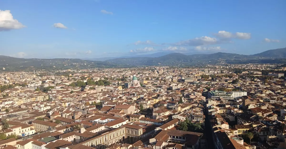 A stunning aerial shot of Florence, Italy, showcasing its iconic red rooftops and historic architecture.