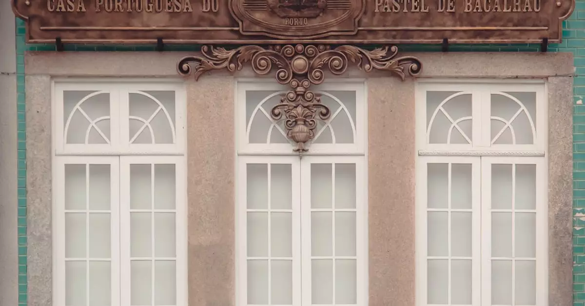 Classic Portuguese architecture with intricate sign and pastel colors in Oporto, Portugal.