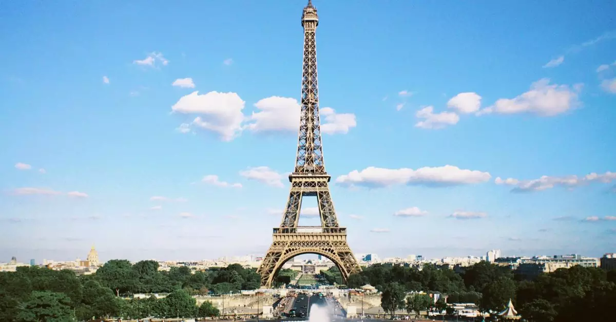 Stunning view of the Eiffel Tower on a sunny day in Paris, capturing the essence of French architecture.