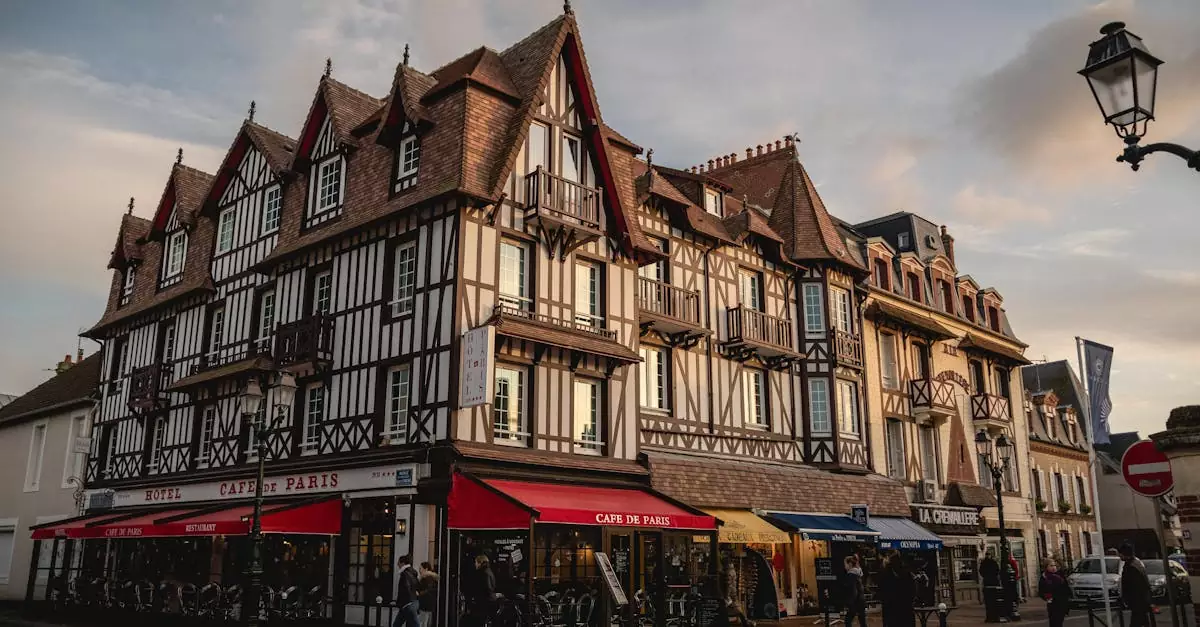 A picturesque street corner in Deauville, Normandy, showcasing classic architecture at sunset.