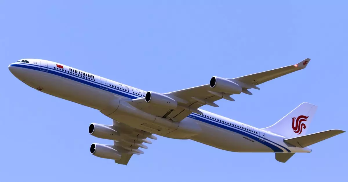 Low angle shot of an Air China airplane flying against a clear blue sky.