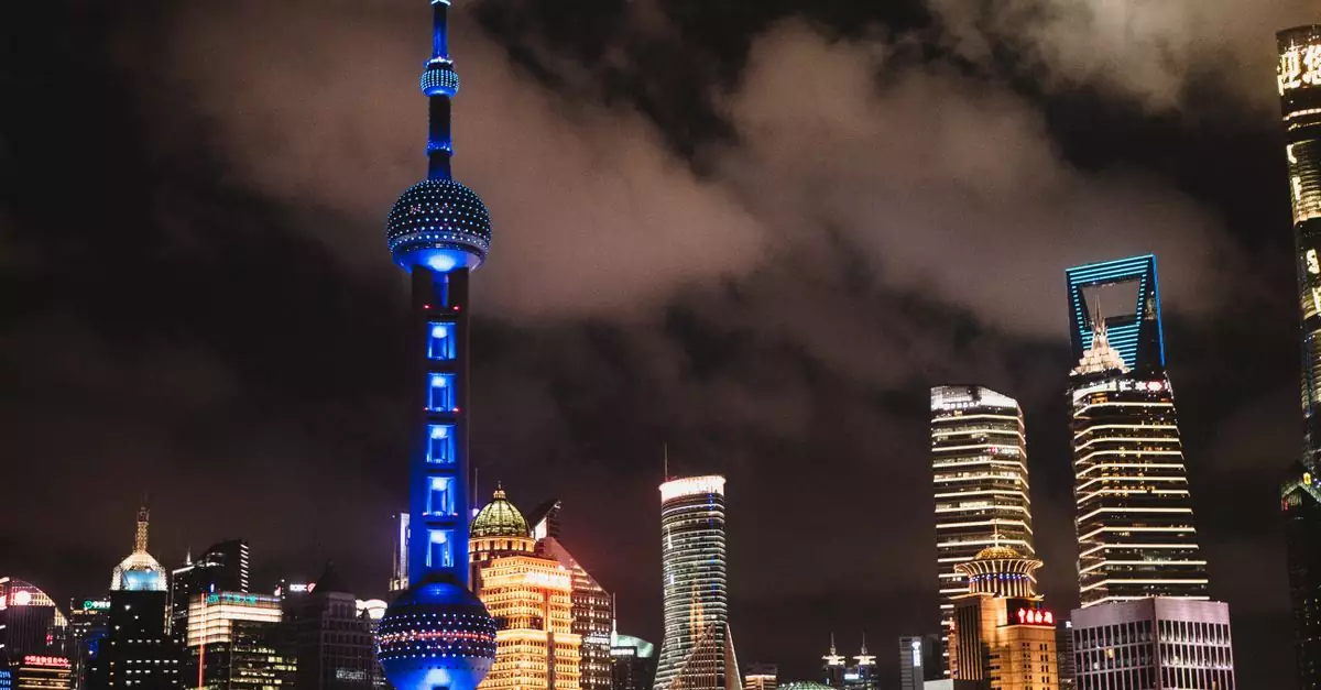 Captivating night view of Shanghai's illuminated skyline featuring the iconic Oriental Pearl Tower.