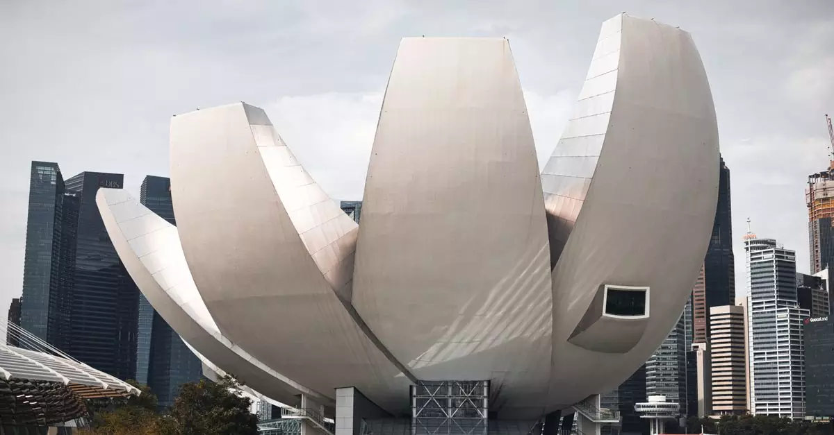 Iconic ArtScience Museum in Singapore with a backdrop of modern skyscrapers.