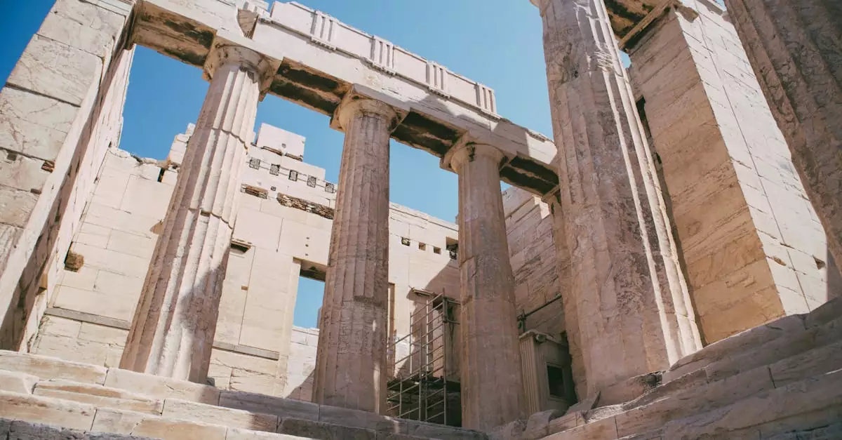 Cultural heritage of ancient Greek architecture with stunning columns under a clear blue sky.