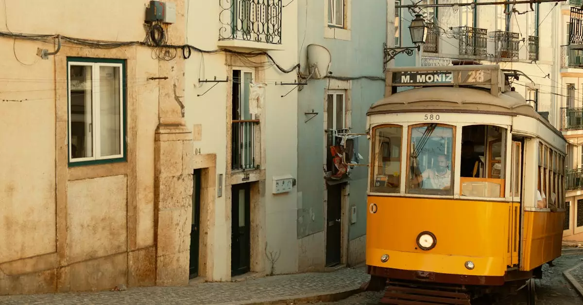 Charming view of a classic yellow tram navigating Lisbon's narrow cobblestone streets.