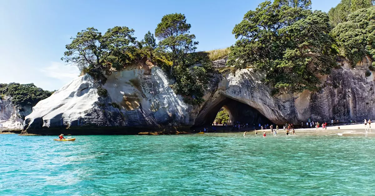 Experience the serene beauty of Cathedral Cove's clear waters and iconic rock formations in Waikato, New Zealand.