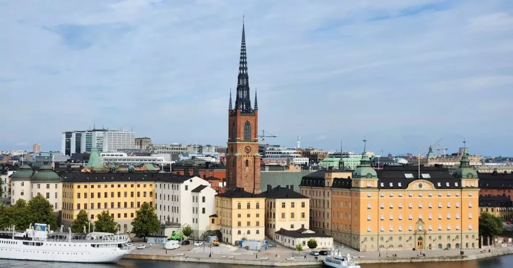 A stunning view of Riddarholmen Church and colorful buildings in Stockholm, Sweden.
