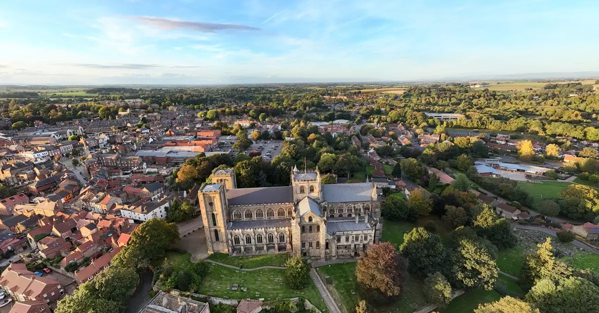Stunning aerial view of Ripon Cathedral surrounded by the historic town and lush countryside.