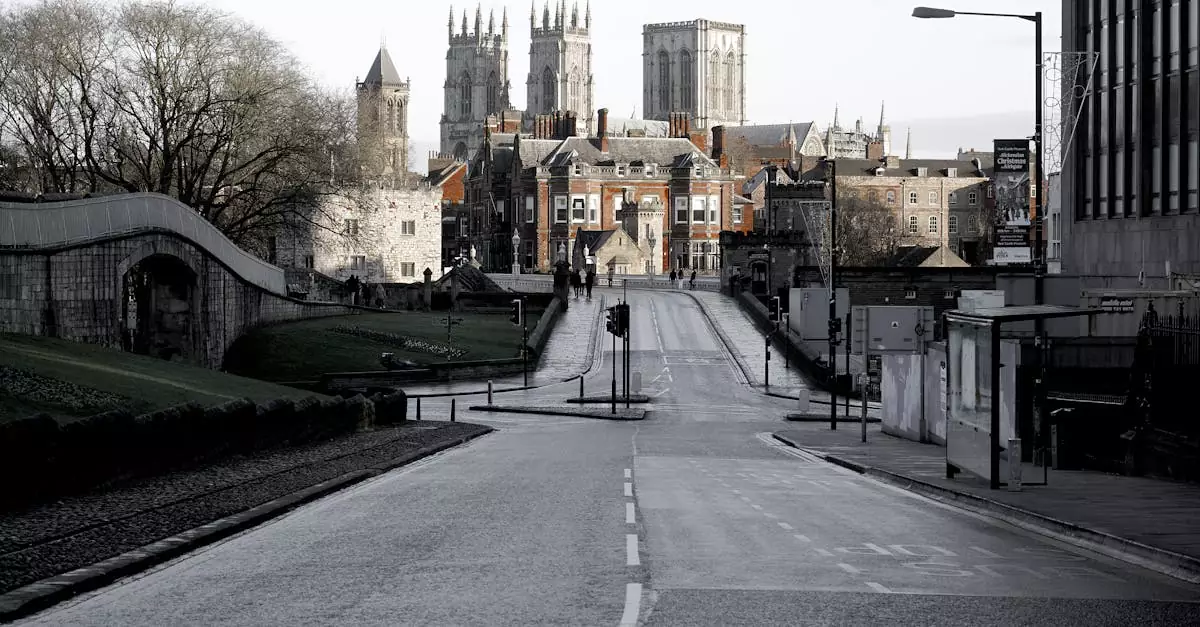 A striking shot of York Minster framed by an empty city street, highlighting historic architecture.