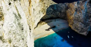A stunning aerial shot of Navagio Beach, featuring the famous shipwreck and clear blue waters.