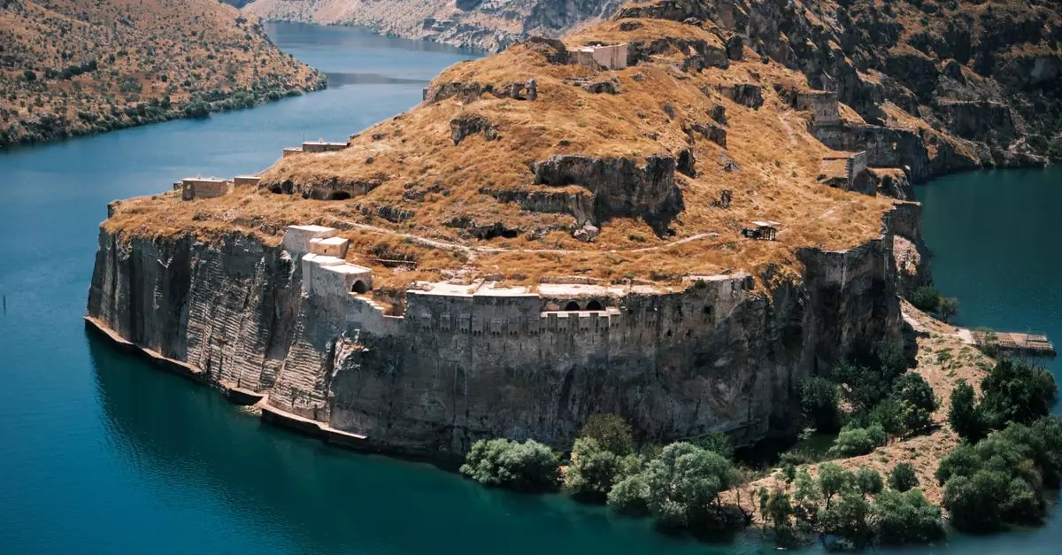 Explore the historical ruins on a cliff surrounded by water in Gaziantep, Türkiye.