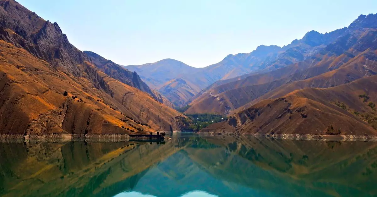 A tranquil lake reflecting mountains in Karaj, Alborz Province, Iran.