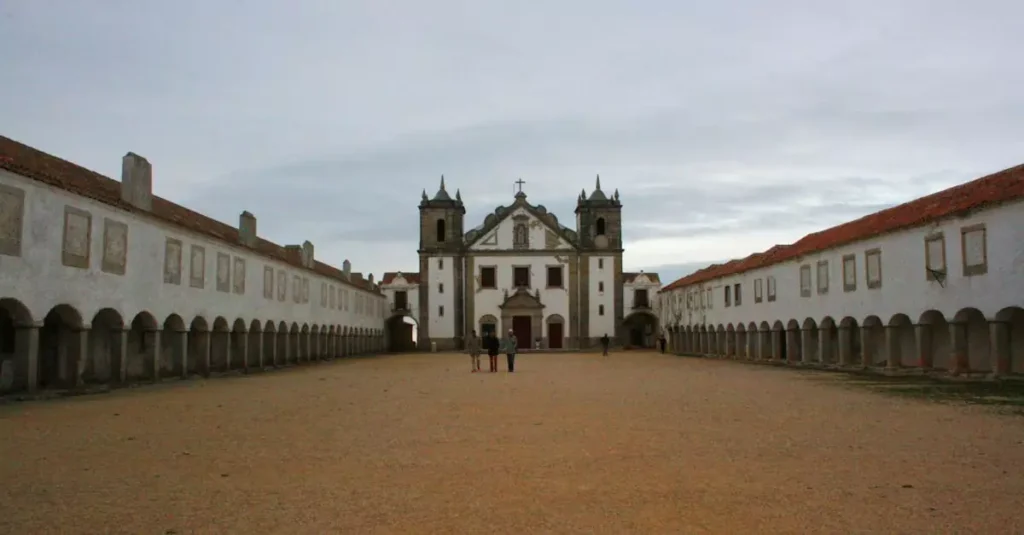 Portugal's Best Hidden Places: Off-the-Beaten-Path Gems 2 View of a historic church courtyard in Portugal, showcasing its architectural elegance.