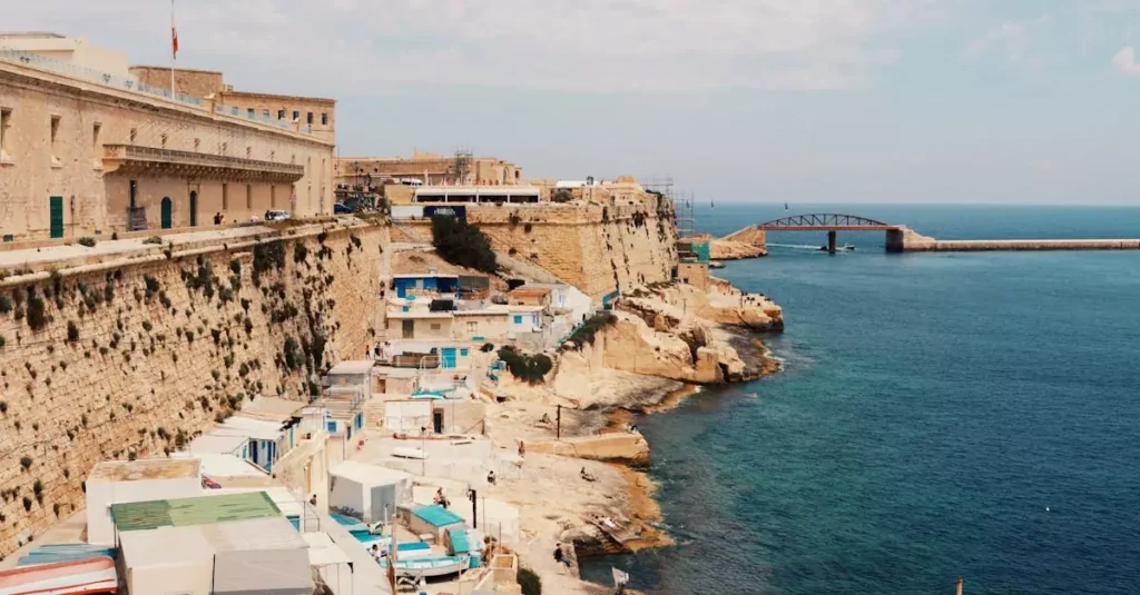 Explore the stunning cliffside and azure waters of Valletta, Malta, showcasing its rich urban landscape.