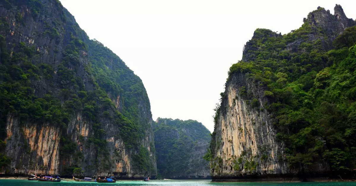 Stunning view of towering limestone cliffs and tropical waters in Krabi, Thailand.