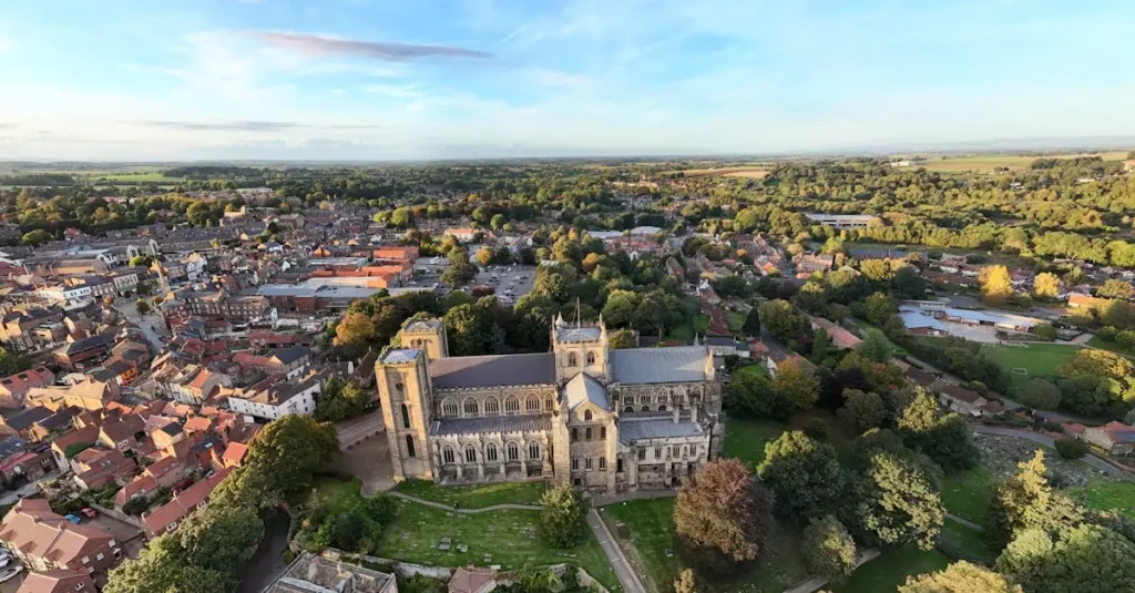 Best Historic Towns England: A Journey Through Time 2 Stunning aerial view of Ripon Cathedral surrounded by the historic town and lush countryside.