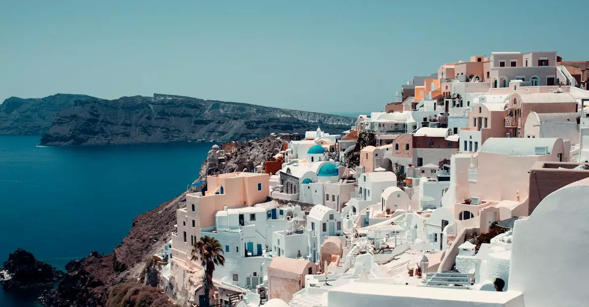 Breathtaking view of iconic white-washed buildings on Santorini's coast.