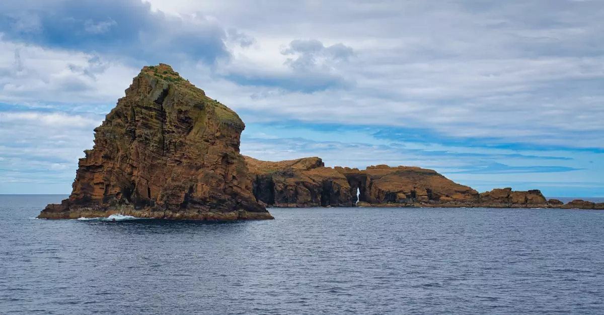 Stunning rock formations in the Azores, Portugal under a dramatic sky over the Atlantic Ocean.