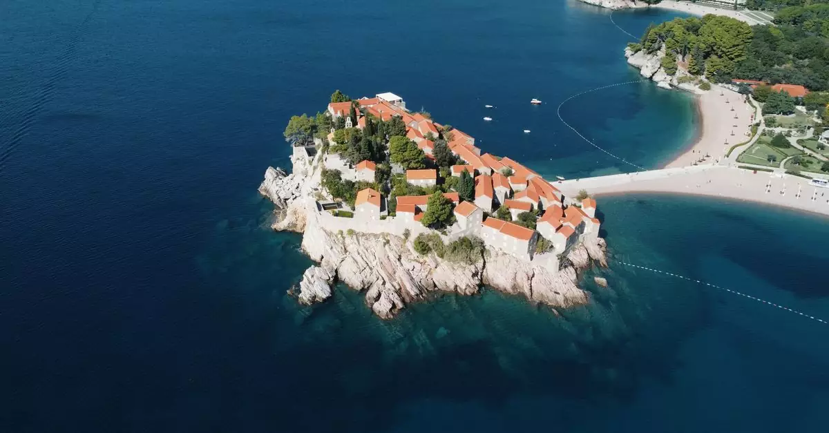 Stunning aerial view of the iconic Sveti Stefan island resort in Montenegro's Adriatic Sea.