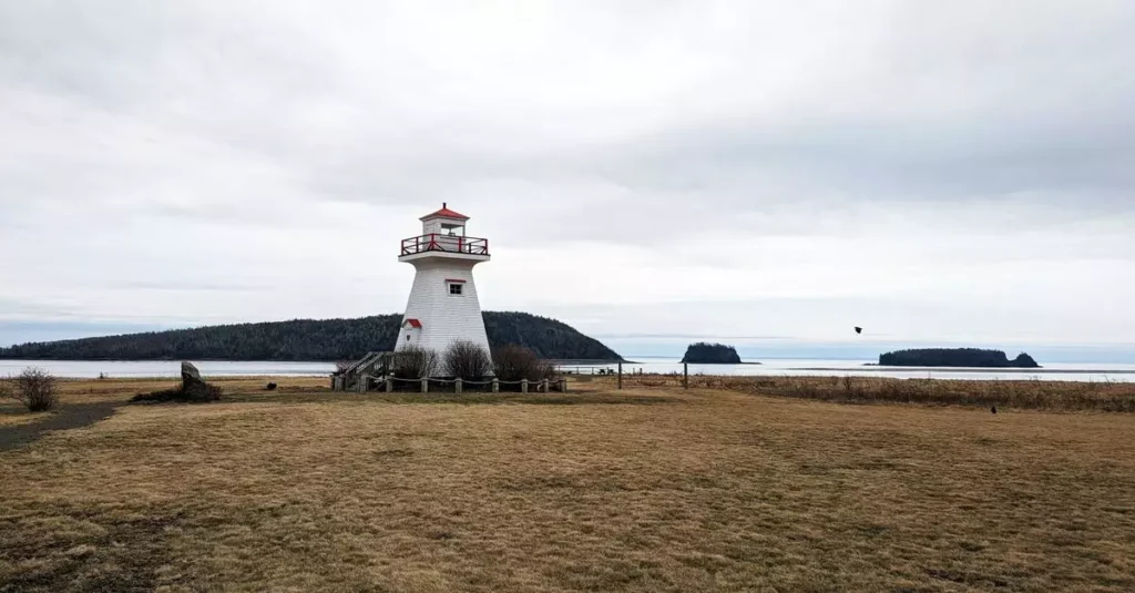 Canada's Best Island Escapes: Your Ultimate Guide 2 Lighthouse overlooking the sea in Five Islands, Nova Scotia, Canada.