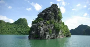 Breathtaking view of rock formations in Ha Long Bay, Vietnam, highlighting lush greenery.