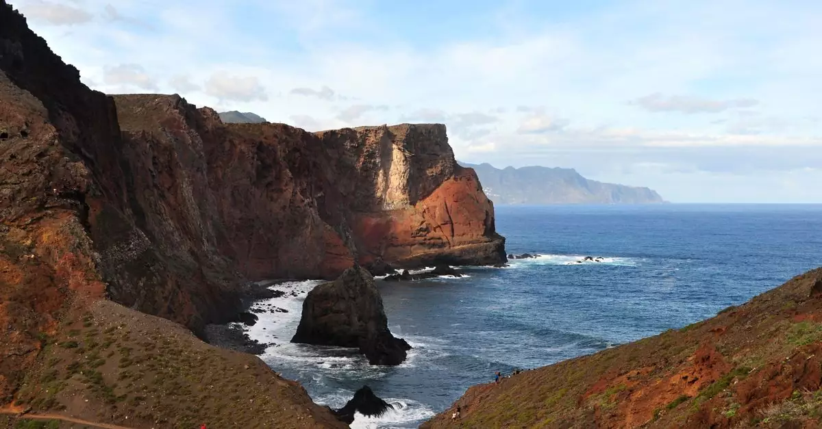 Breathtaking view of cliffs at Ponta de Sao Lourenco, Madeira, Portugal with ocean waves crashing beneath.