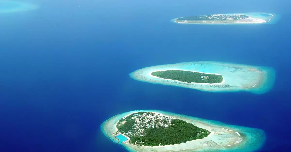 Stunning aerial shot of tropical Maldives islands surrounded by the turquoise sea.