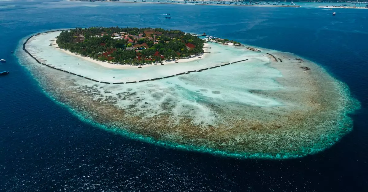Breathtaking aerial shot of a lush tropical island surrounded by vibrant turquoise waters, ideal for vacation.