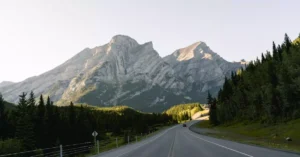 A picturesque view of rocky mountains and road in Banff National Park, Alberta, Canada.