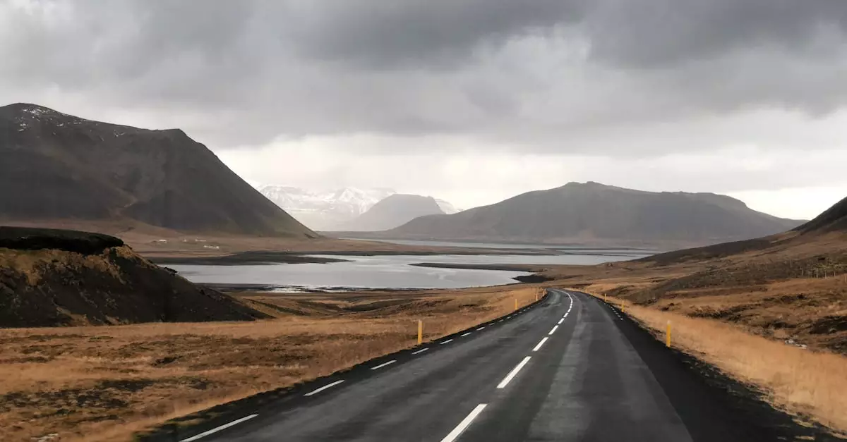 Explore the breathtaking Icelandic countryside with this stunning mountain road view, perfect for nature lovers.