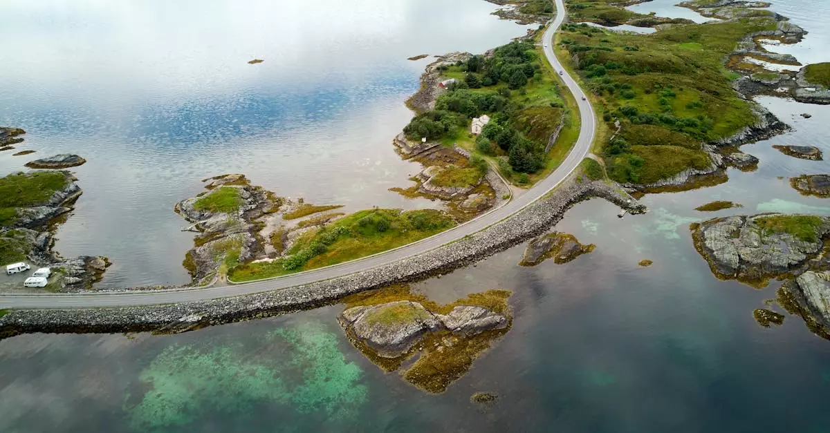 Aerial view of the famous Atlantic Ocean Road winding through Norway's scenic landscape.