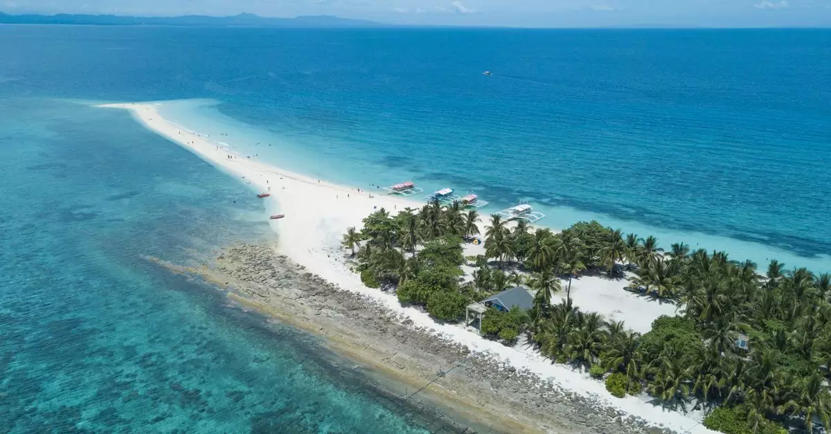 Discover the breathtaking beauty of Kalanggaman Island, a tropical paradise with white sand beaches in the Philippines.